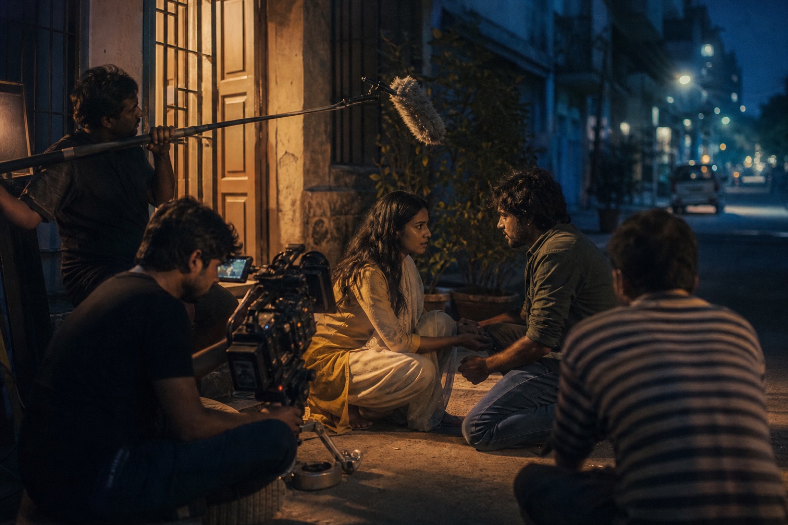 Independent short film crew shooting an intimate scene at dusk